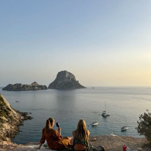 A view from Es Vedra cliff overlooking the sea at sunset in Ibiza.