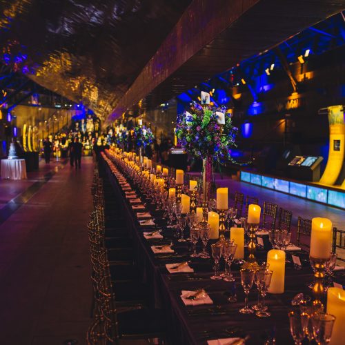 A candle-lit dinner set up underneath the Cutty Sark