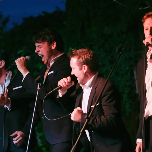 A group of singers performing at an event provided by HOMETAINMENT
