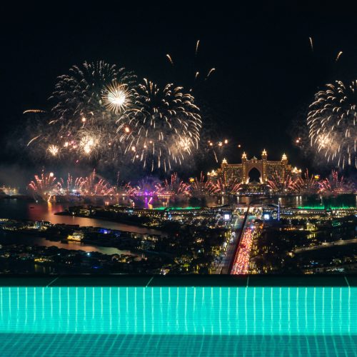 The view out of Aura Skypool with fireworks in the background