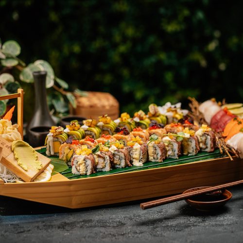 A platter of sushi served ay Bla Bla Dubai on a boat shaped platter