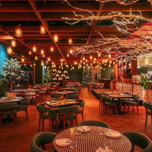 The Bla Bla Dining room set up in the evening, decorated with fairy lights