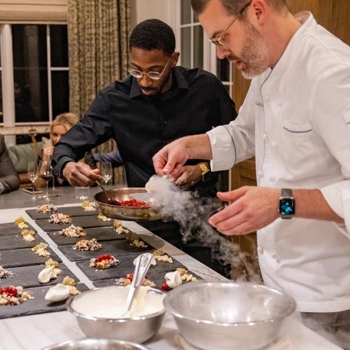 A chef doing demonstrations at a dinner party