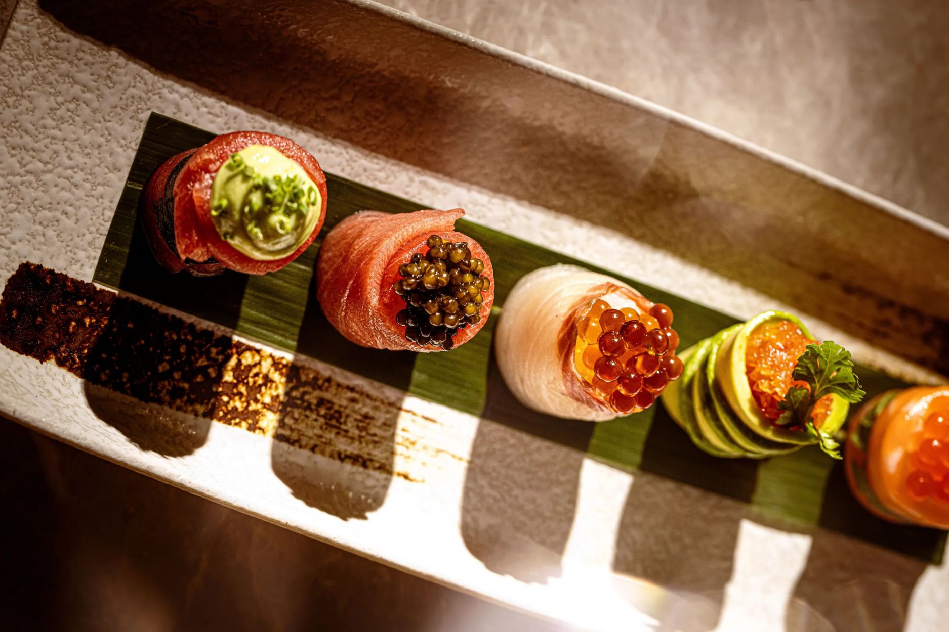 Caviar being served on a small plate at CÉ LA VI