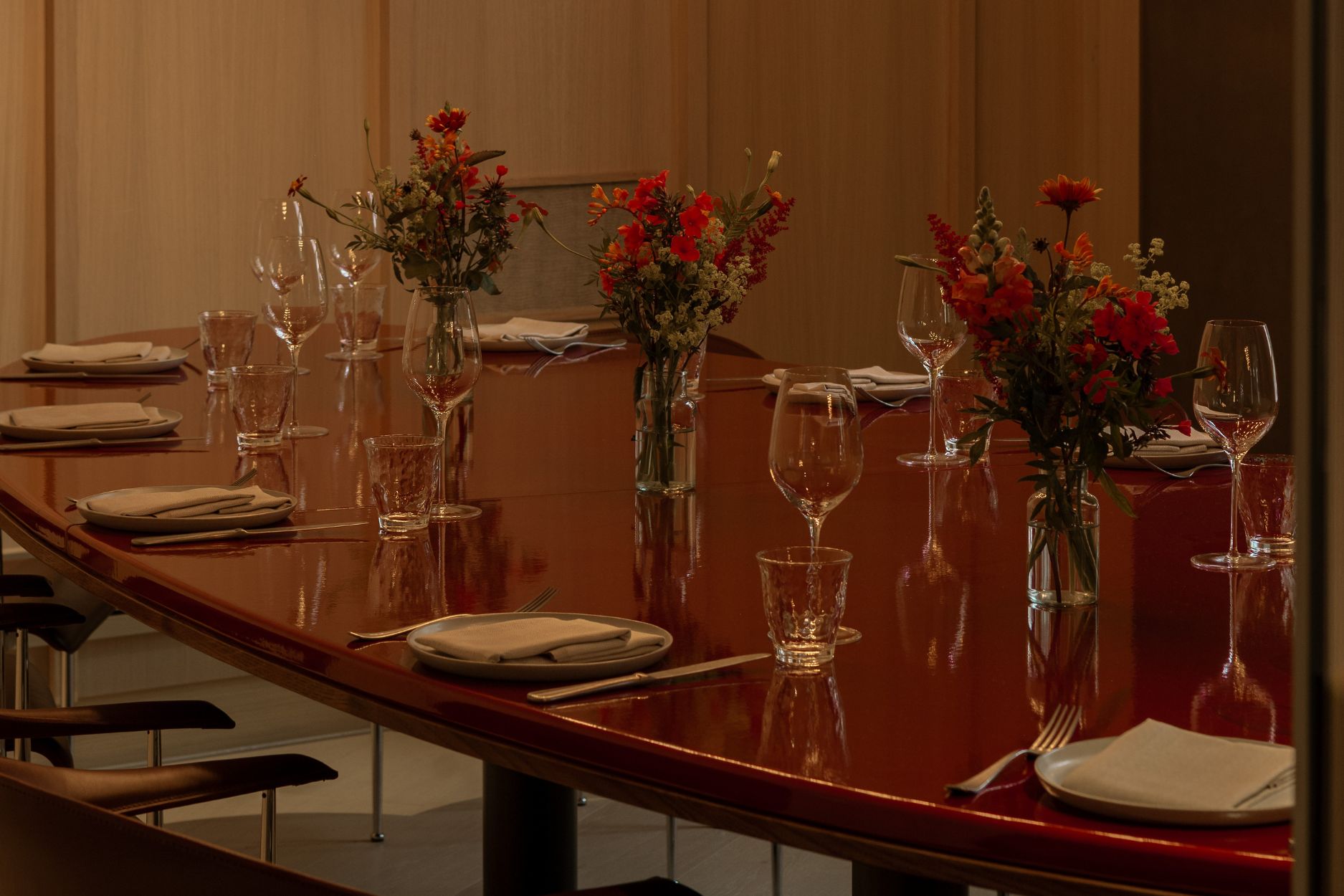 The table in the private dining room at Nela, decorated with flowers and ready for a dinner