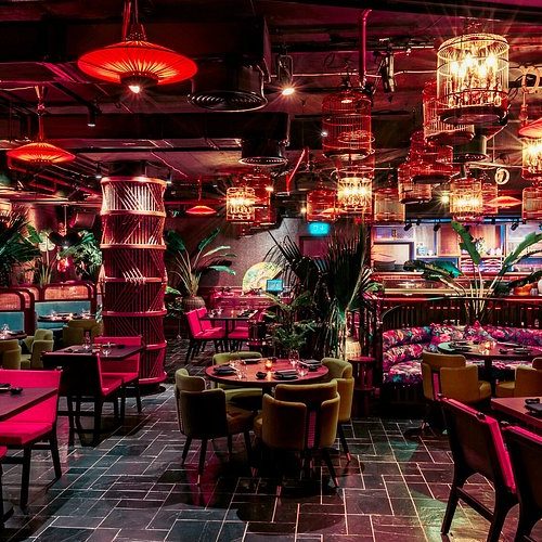 Inside of Asia Asia The Palm with tables laid up and dim lighting