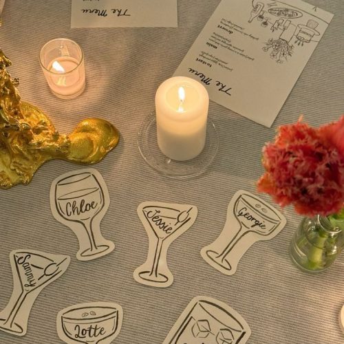 Place names written in different glasses, such as a wine glass and a martini glass