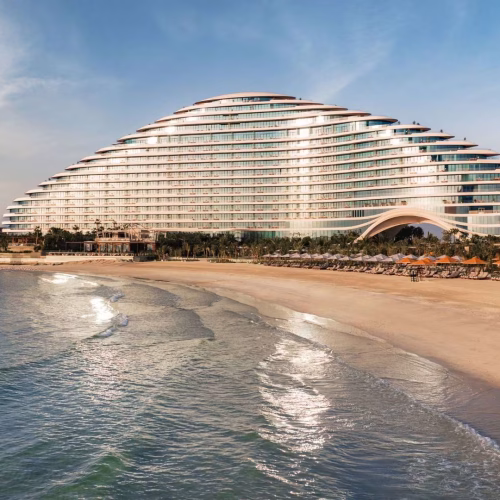 The outside of Jumeirah Marsa Al Arab, with the super-yacht shaped building overlooking the private beach and the sea