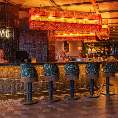 The bar at Salvaje in orange dim lighting
