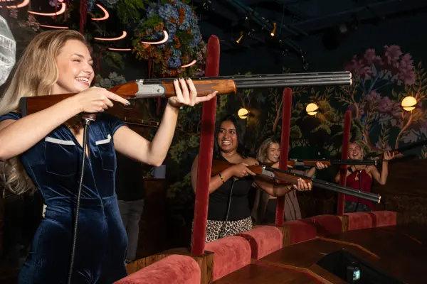 Someone enjoying the shooting simulation at The Hide at Clays Soho