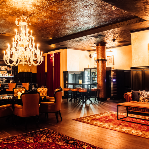 Casual seeing at 45 London, with a chandelier and low lighting