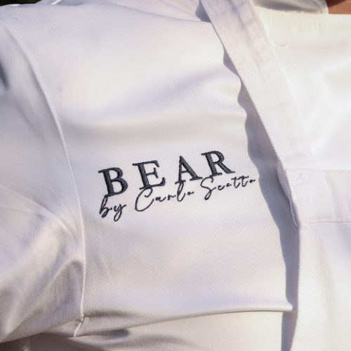 A chefs jacket embroidered with the restaurant name, BEAR by Carlo Scotto
