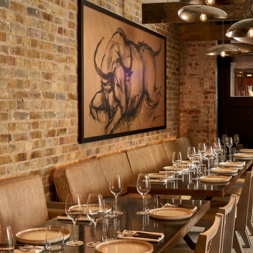 The private dining room at Kolamba East set up with one long table