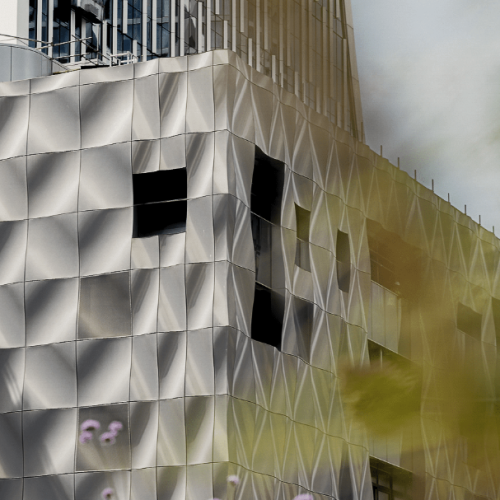 A sneak peak of the outside of Landing Canary Wharf, a geometric and unique building