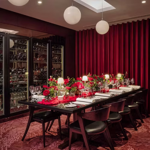 The private dining room at Conrad St James set up for a private dinner for 8 guests