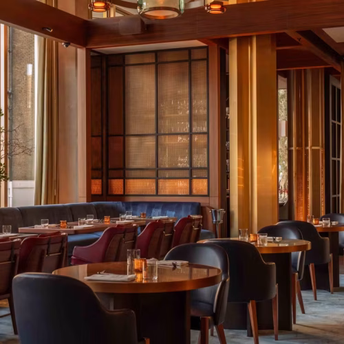The inside of the dimly lit dining room at Tobi Masa at The Chancery Rosewood
