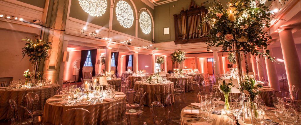 An event set up at One Marylebone, decorated with large flowers and soft pink lighting
