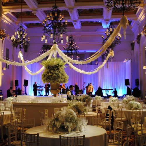 A ball-room style room at 8 Northumberland Avenue, decorated beautifully for a large event with flowers and draping