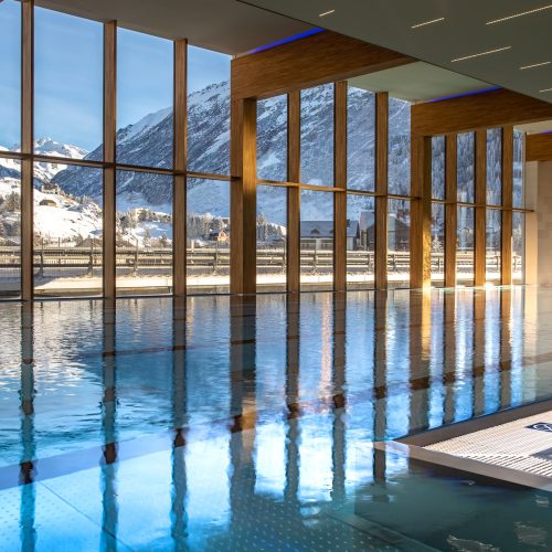 The pool at Radisson Blu Hotel Reussen, Andermatt, which has large windows that overlook the Swiss alps
