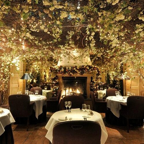 The main dining area at Clos Maggiore, which is romantically decorated with blossom trees and fairy lights
