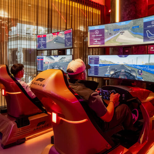 A couple enjoying F1 simulators on Valentines day at F1 Arcade