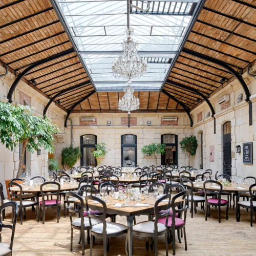 One of the main event spaces at Châteauform', set up for a private dinner