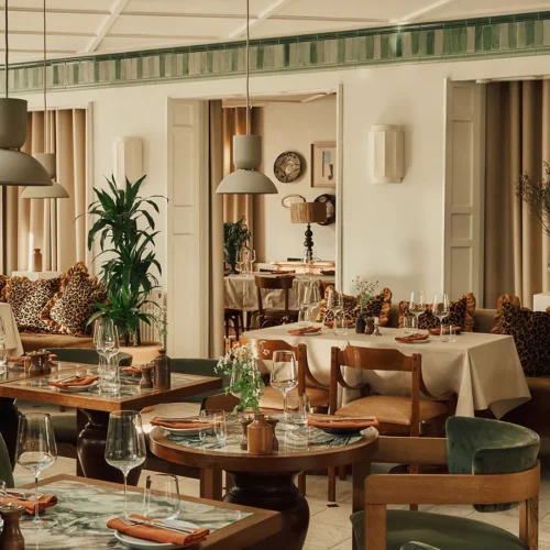 The main restaurant at Crafted at Powdermills, decorated with plants and bohemian furnishings