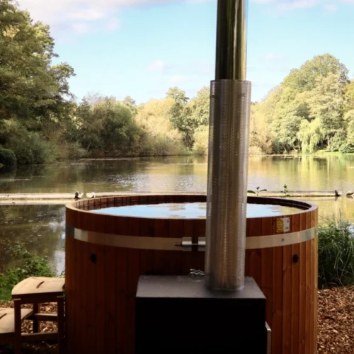 A hot tub on overlooking the large lake at Crafted at Powdermills