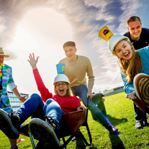 A team enjoying fun team building activities on their away day with Firebird Events
