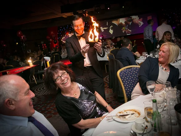 A roaming magician performing a trick with fire, supplied by GOTO Events