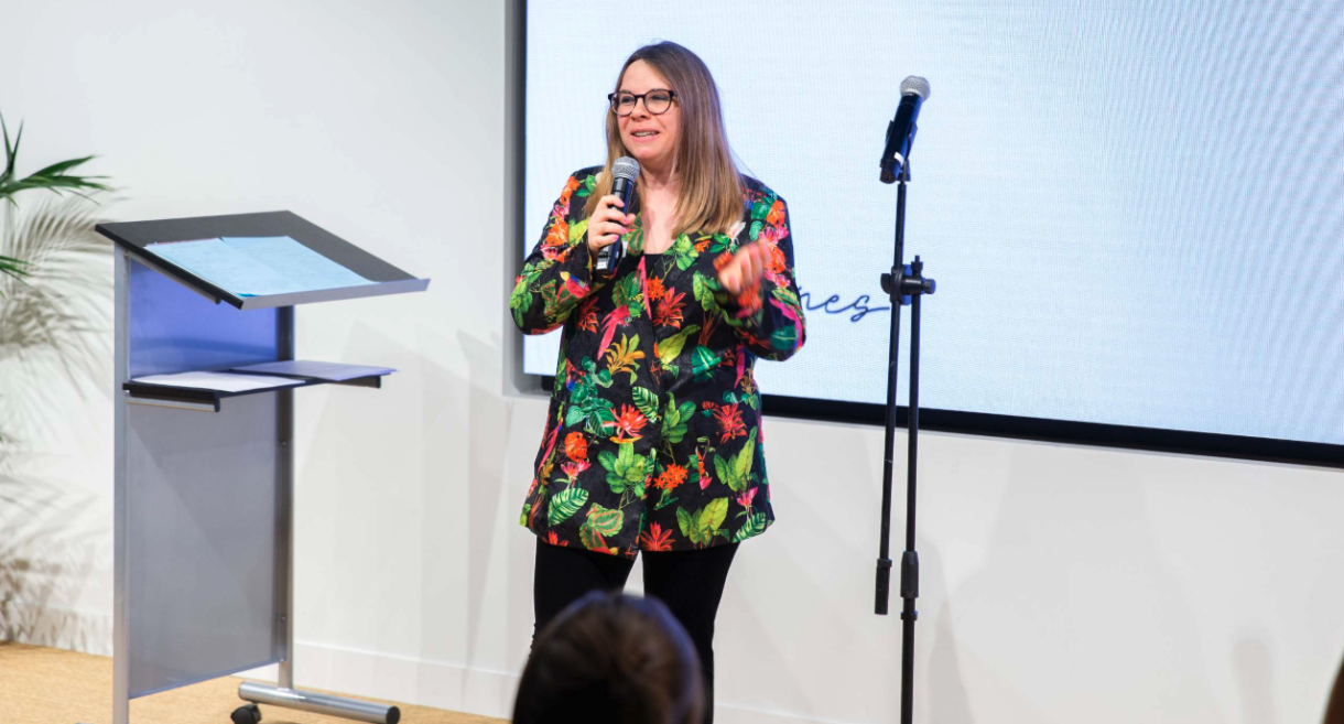 A comedian from Comedy in the Office, presenting to a corporate team