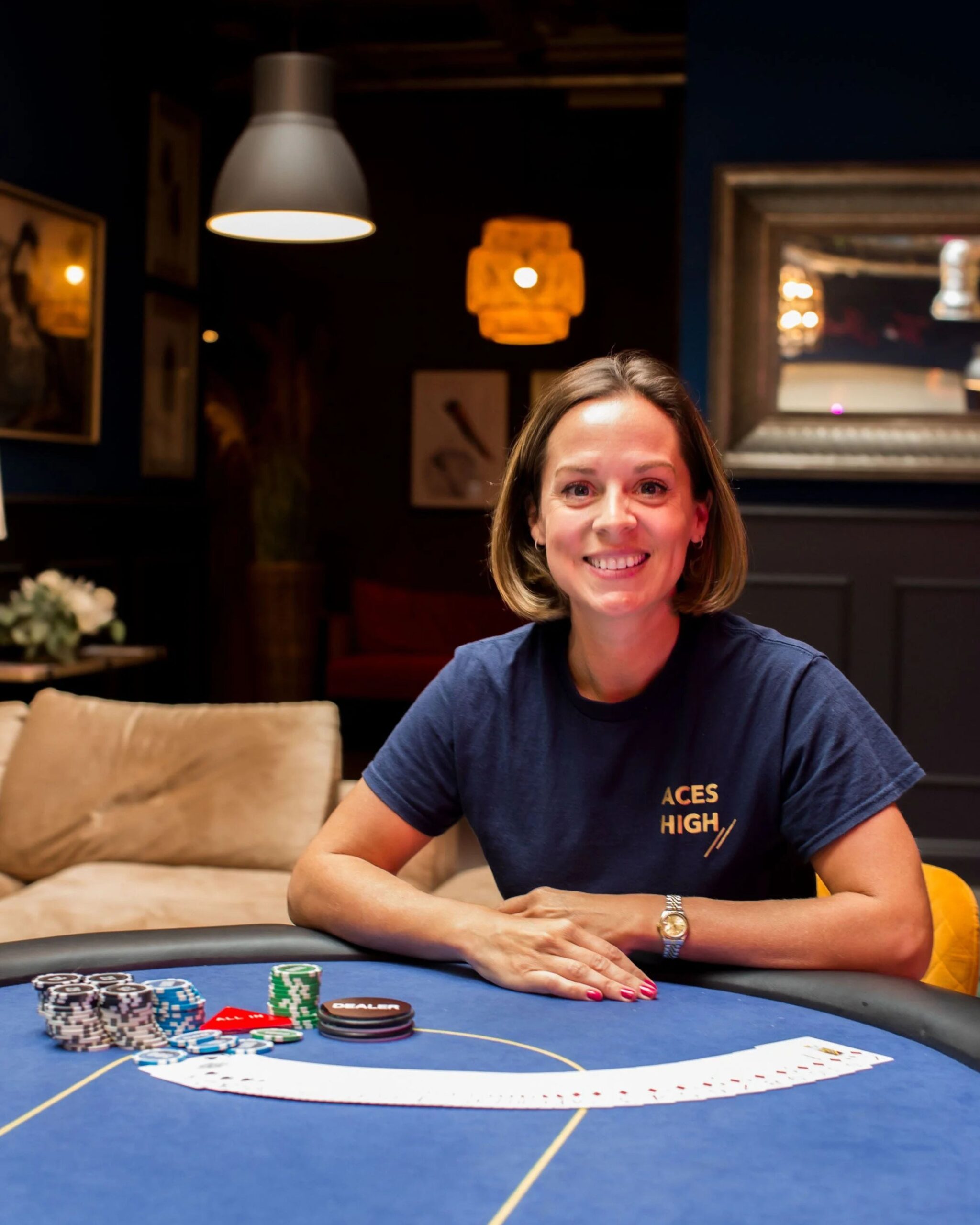 The founder of Aces High at a poker table, ready to talk about how you can use skills from the poker table to improve your attitude at work