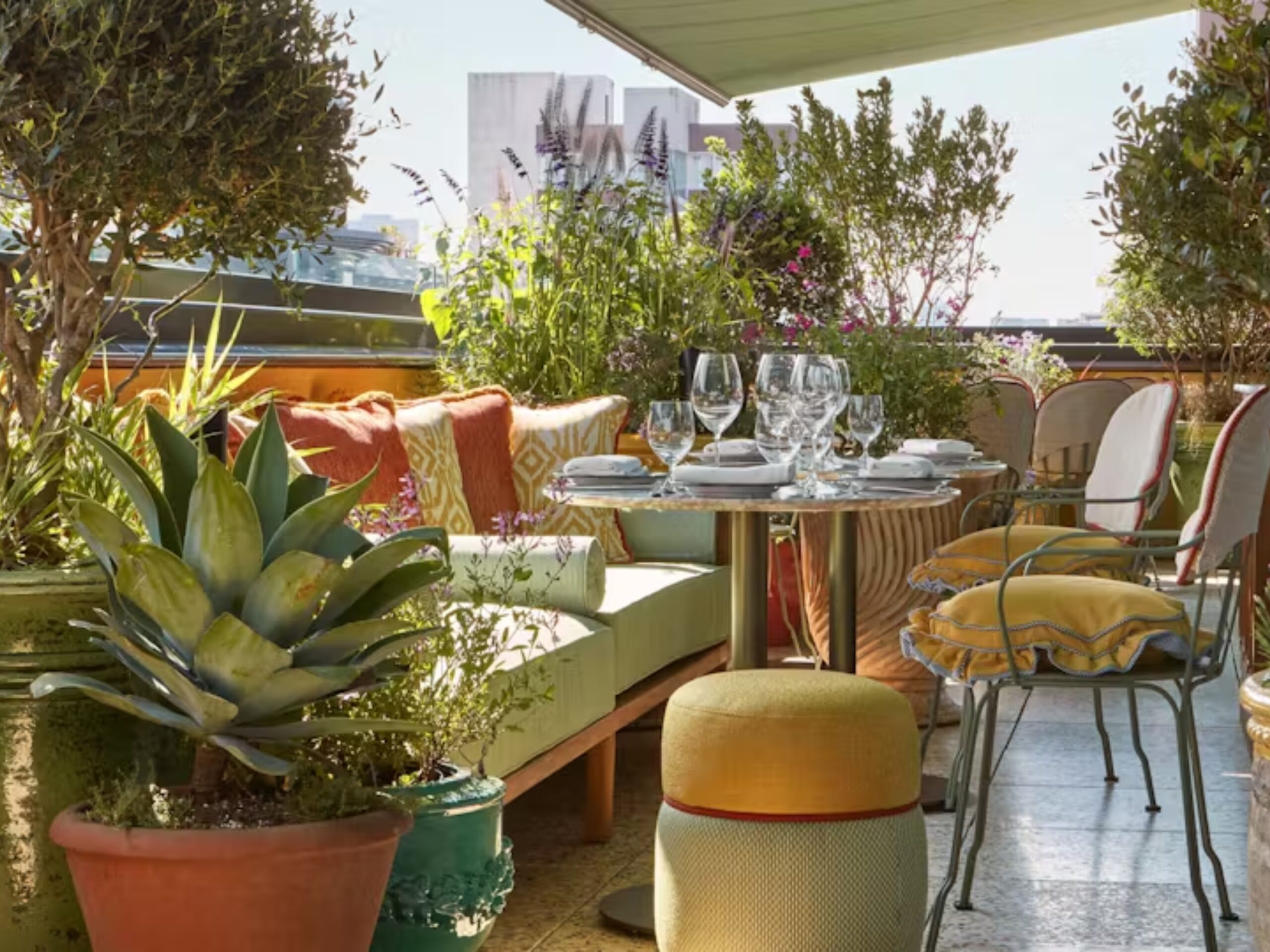 Flute Rooftop, decorated with cosy furniture and plenty of plants and greenery
