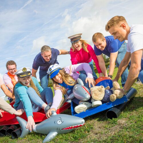 A team bonding as they do a fun challenge supplied by Firebird Events