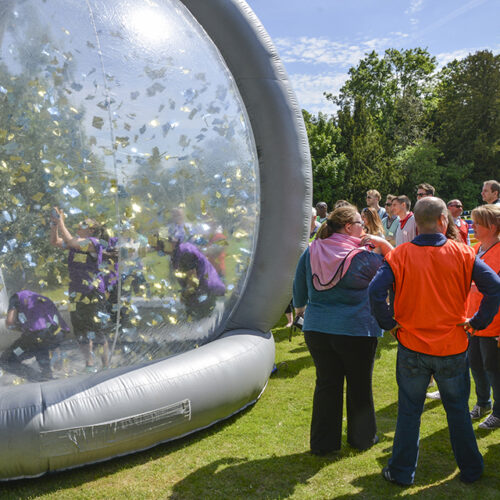 A large team enjoying a pop up team building game supplied by GoTo Events at their Christmas Party