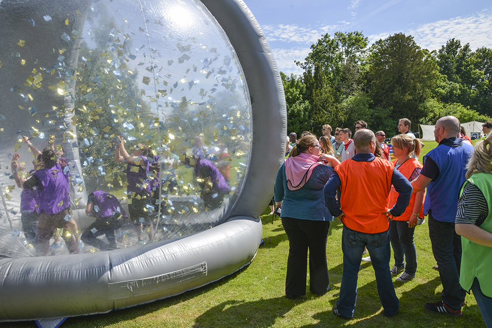 A large team enjoying a pop up team building game supplied by GoTo Events at their Christmas Party