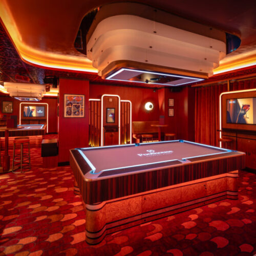 One of the private rooms at Poolhouse with a central pool table, perfect for team building for groups of all sizes