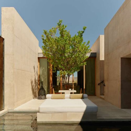 A private pool and sun lounger at Amangiri, surrounded by white washed walls