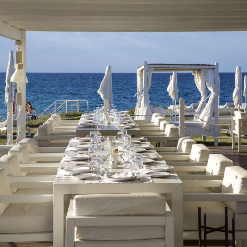 The restaurant at Borgo Egnazia, which overlooks the sea and is decorated with classy white linen