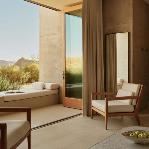 A view out of a balcony room at Amangiri, which has a private sun lounger