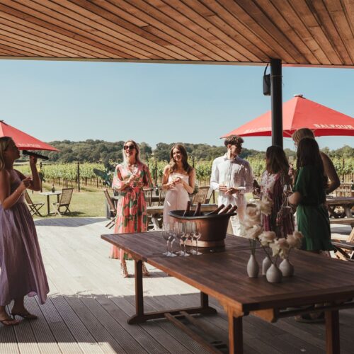 Guests enjoying a live performance under the veranda at Balfour Winery