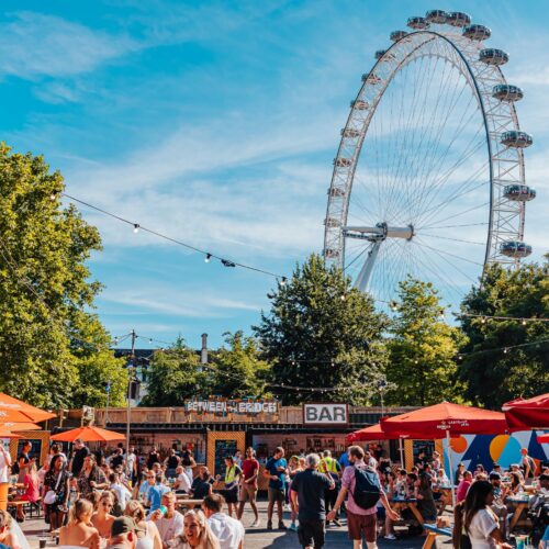 Guests gathered, enjoying relaxed food and drinks at Between the Bridges in the sun