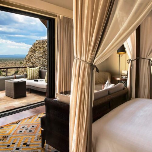 A double room which leads out onto a private balcony at Four Seasons Safari Lodge Serengeti