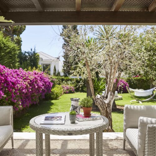 A table and chairs on a private balcony in Marbella Club Hotel