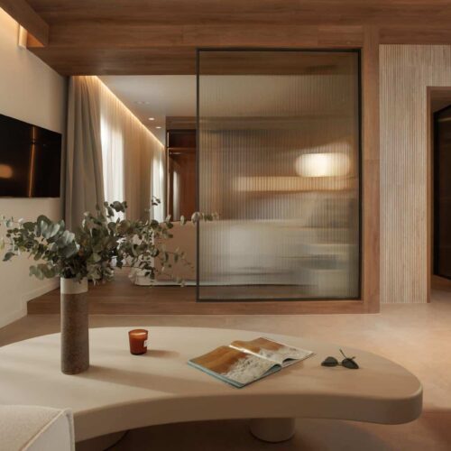 Inside one of the bedrooms at Laguna Coast Resort, which is decorated with neutral tones and minimalistic decorations
