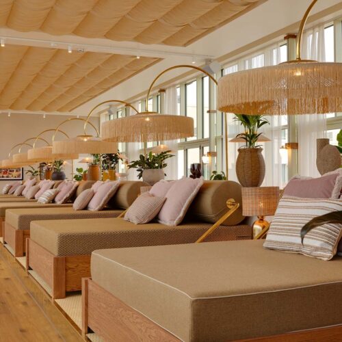 The pool beds at Hjortviken Country Club, each with their own large pillows, tables, and lamps