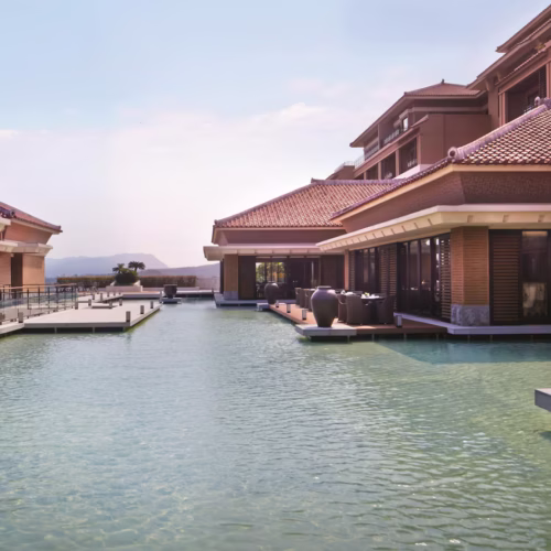 The main pool area in The Ritz-Carlton, surrounded by bars and restaurants