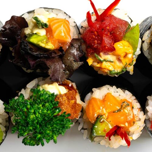 Pieces of sushi from above, filled with different fish and vegetables