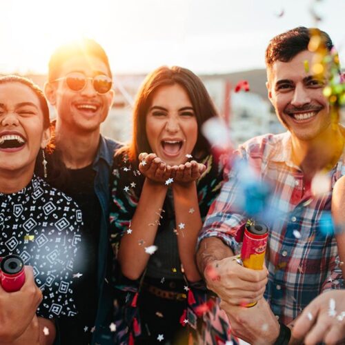 Guests laughing and enjoying a party created by GOTO Events